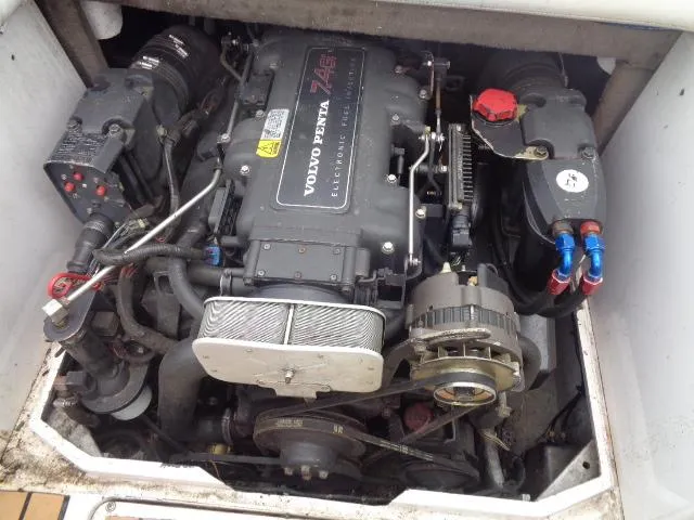 Slide: The Image of 1996 Four Winns 240 Horizon boat engine compartment with Volvo Penta 7.4GL engine. - 24
