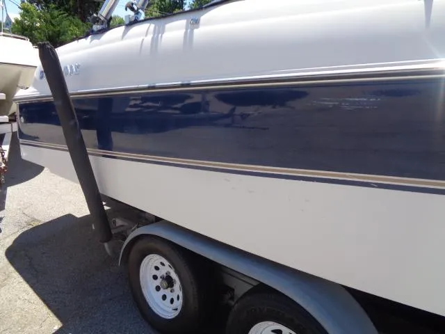 Slide: The Image of 1996 Four Winns 240 Horizon boat on trailer, side view. - 8
