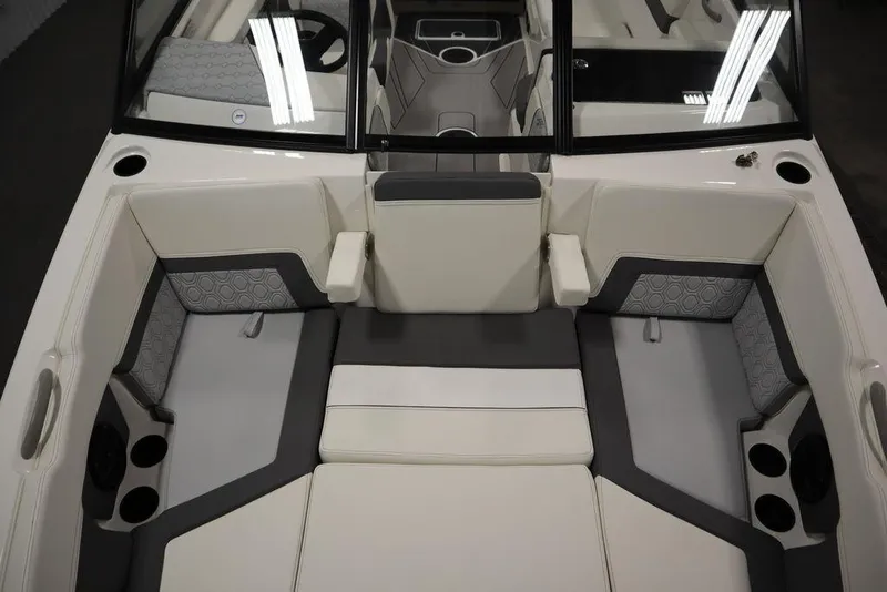 Slide: The Image of 2024 Heyday H22 boat interior with cushioned seating and cup holders. - 11