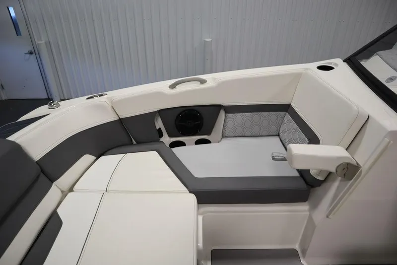 Slide: The Image of 2024 Heyday H22 boat interior seating with cup holders and speaker. - 15