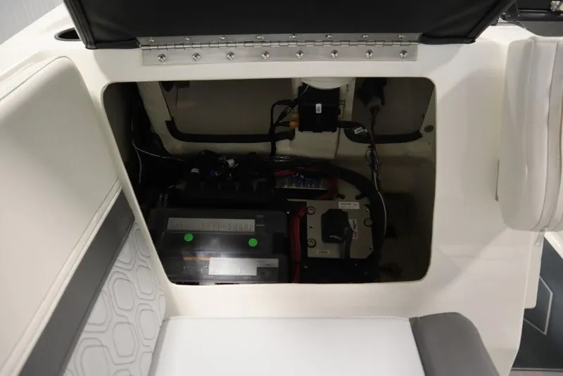 Slide: The Image of 2024 Heyday H22 boat battery compartment with wiring and components. - 18