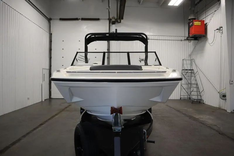 Slide: The Image of 2024 Heyday H22 boat in a storage facility, front view. - 2