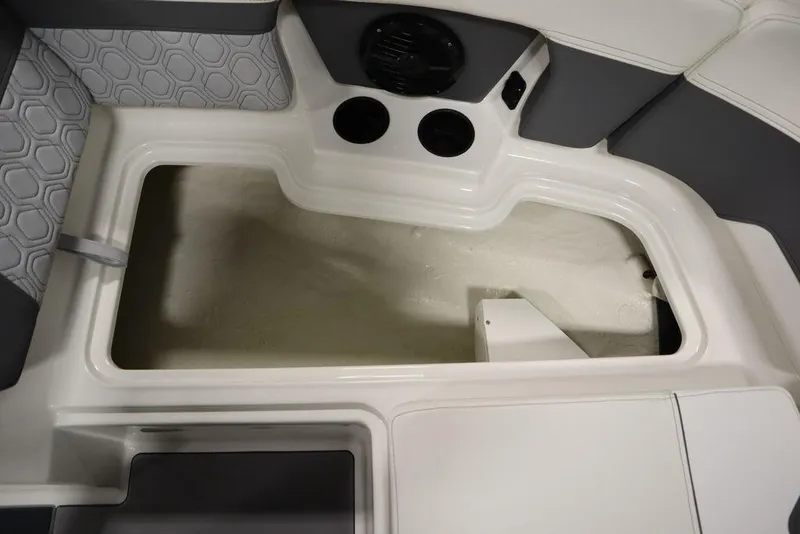 Slide: The Image of 2024 Heyday H22 boat interior storage compartment with cup holders and speaker. - 20