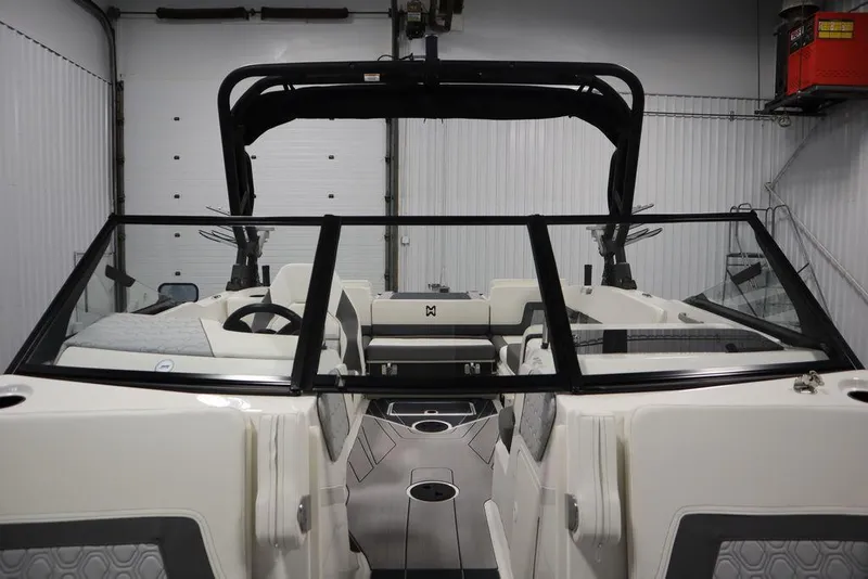 Slide: The Image of 2024 Heyday H22 boat interior with black windshield and white seating. - 23