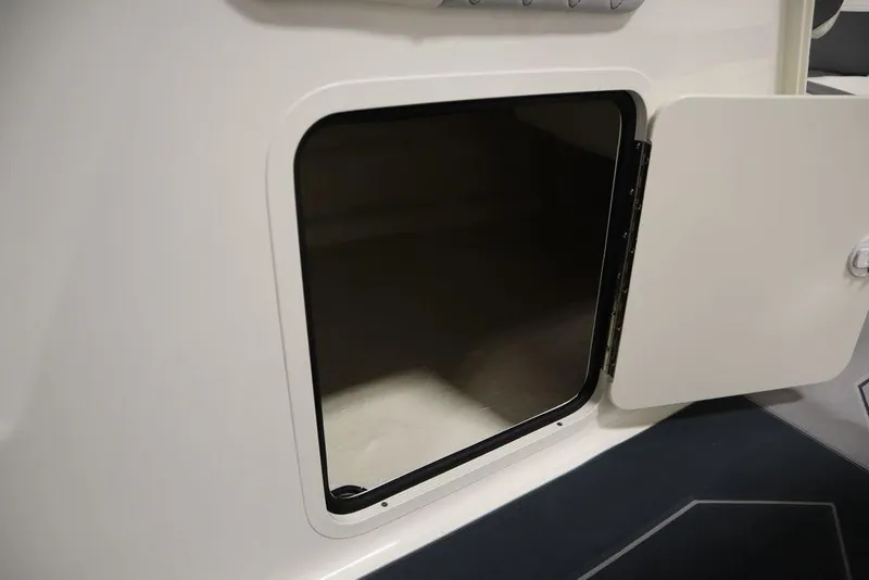 Slide: The Image of Open storage compartment on the 2024 Heyday H22 boat. - 27
