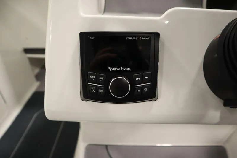 Slide: The Image of 2024 Heyday H22 boat dashboard with Rockford Fosgate audio system. - 31