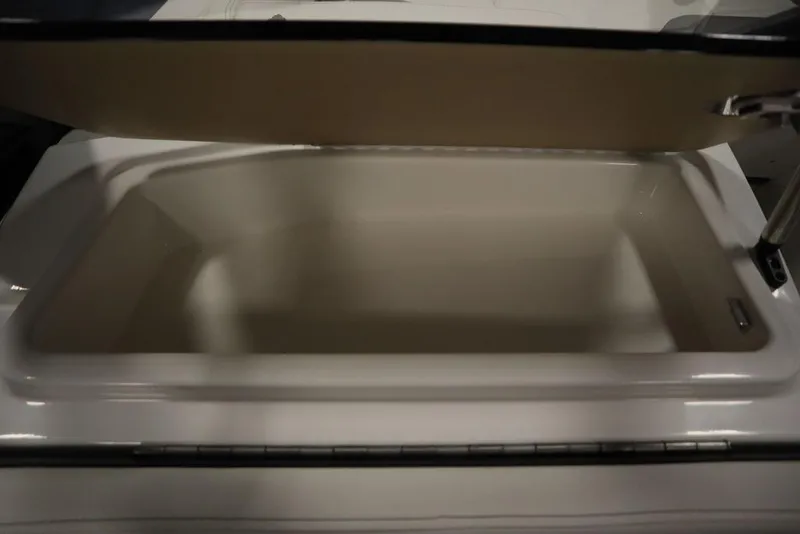 Slide: The Image of 2024 Heyday H22 boat storage compartment with open lid. - 41