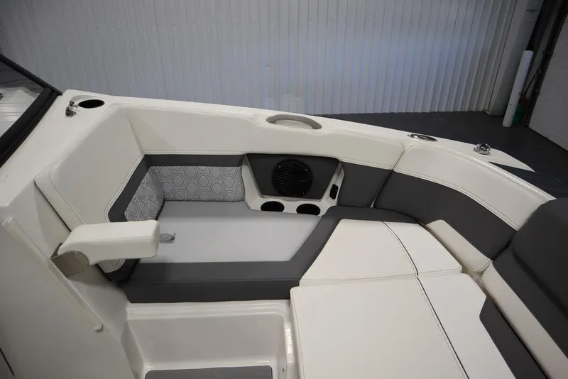 Slide: The Image of 2024 Heyday H22 boat interior with white and gray seating. - 19