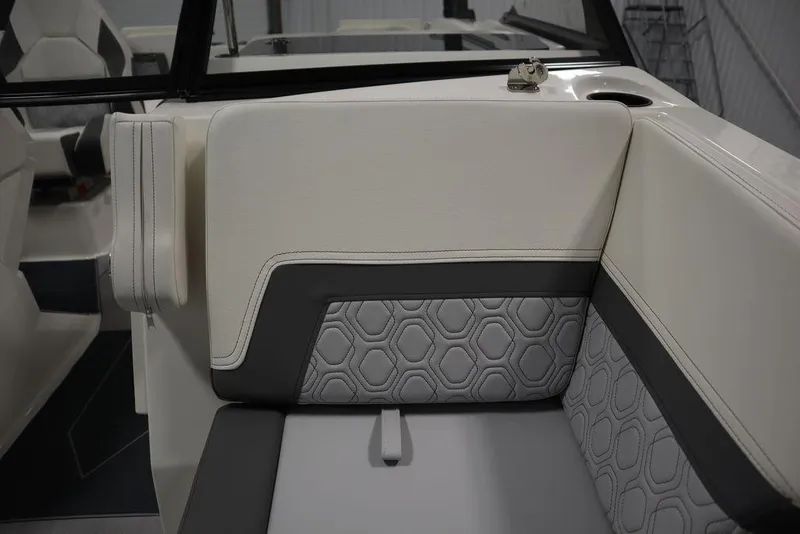 Slide: The Image of 2024 Heyday H22 boat interior with white and gray cushioned seating. - 21