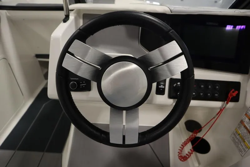Slide: The Image of 2024 Heyday H22 boat steering wheel and dashboard controls. - 28