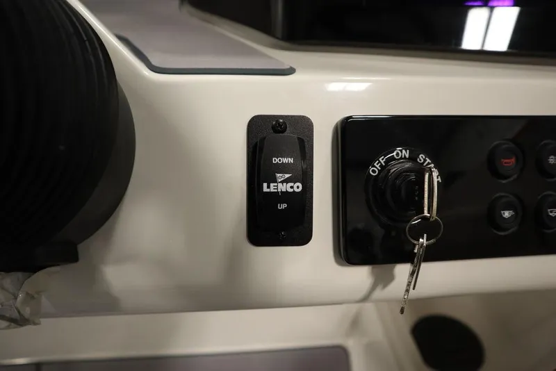 Slide: The Image of Close-up of 2024 Heyday H22 boat control panel with Lenco trim tab switch. - 32