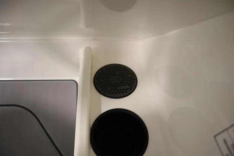 Slide: The Image of 2024 Heyday H22 boat interior drain and cup holder. - 34