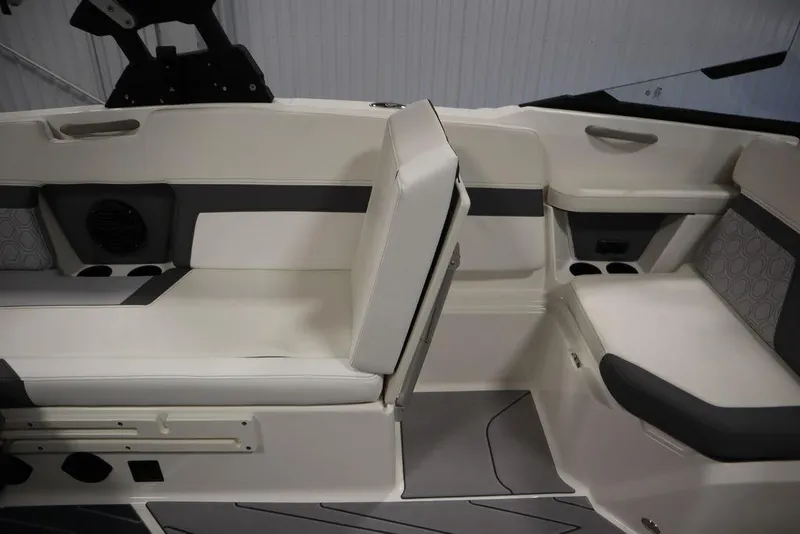 Slide: The Image of 2024 Heyday H22 boat interior seating with white and gray upholstery. - 44