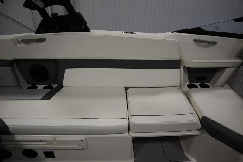 Slide: The Image of 2024 Heyday H22 boat interior seating with white and gray upholstery. - 45