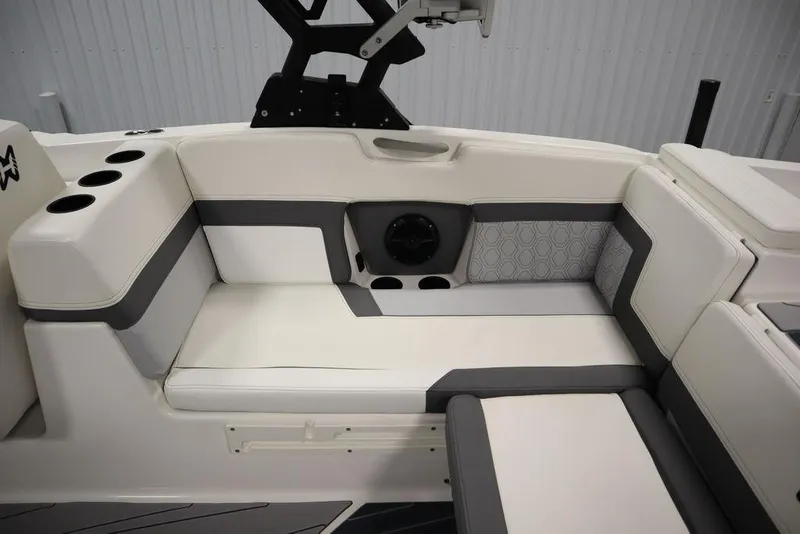 Slide: The Image of 2024 Heyday H22 boat interior seating with cup holders and speaker. - 47