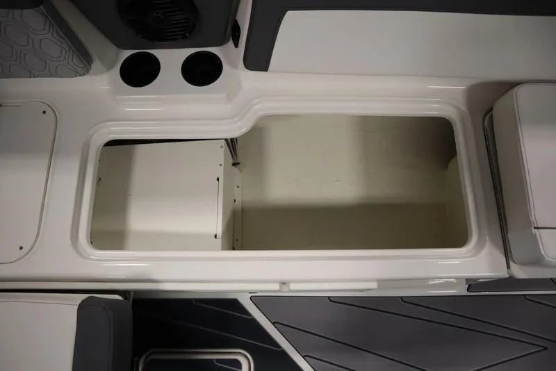 Slide: The Image of 2024 Heyday H22 boat storage compartment with cup holders and seating area. - 48