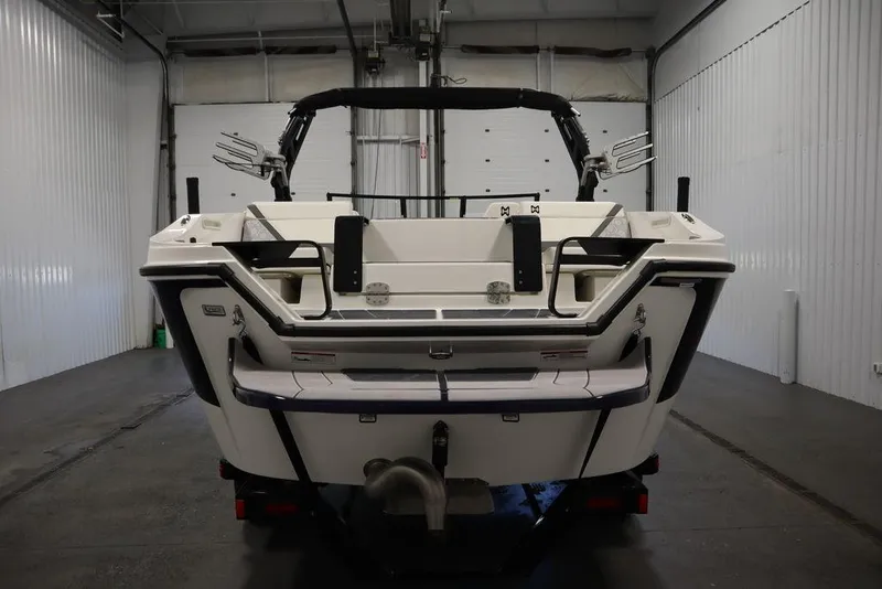 Slide: The Image of 2024 Heyday H22 boat rear view in a storage facility. - 7