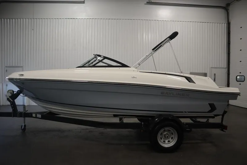 Slide: The Image of 2024 Bayliner VR4 Bowrider boat on trailer in indoor storage. - 10