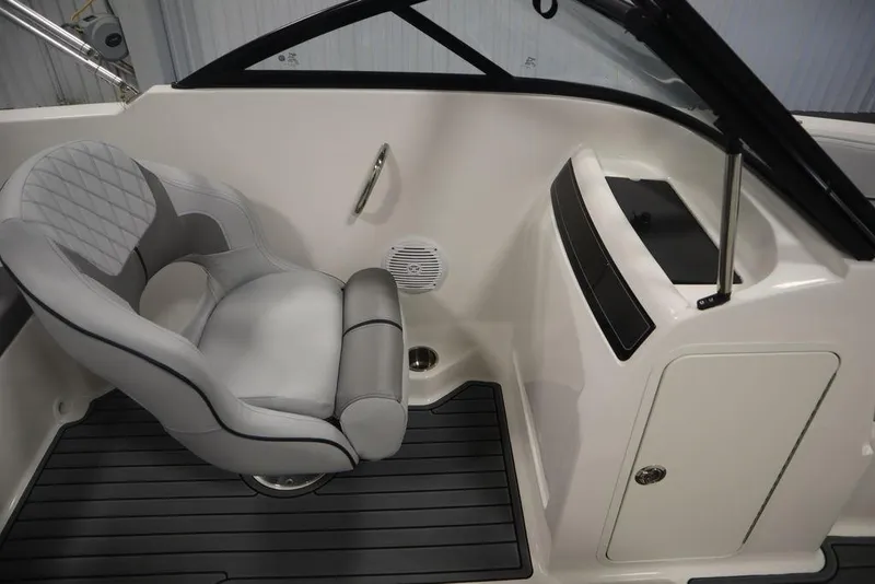 Slide: The Image of 2024 Bayliner VR4 Bowrider interior with captain's chair and dashboard. - 11