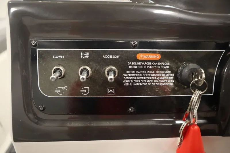 Slide: The Image of Control panel of a 2024 Bayliner VR4 Bowrider boat with blower, bilge pump, and accessory switches. - 17