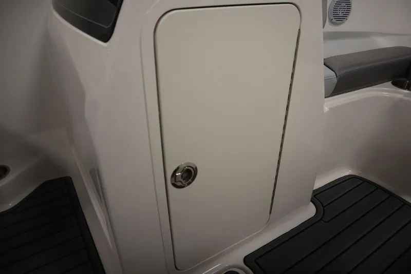 Slide: The Image of 2024 Bayliner VR4 Bowrider storage compartment with black flooring. - 2