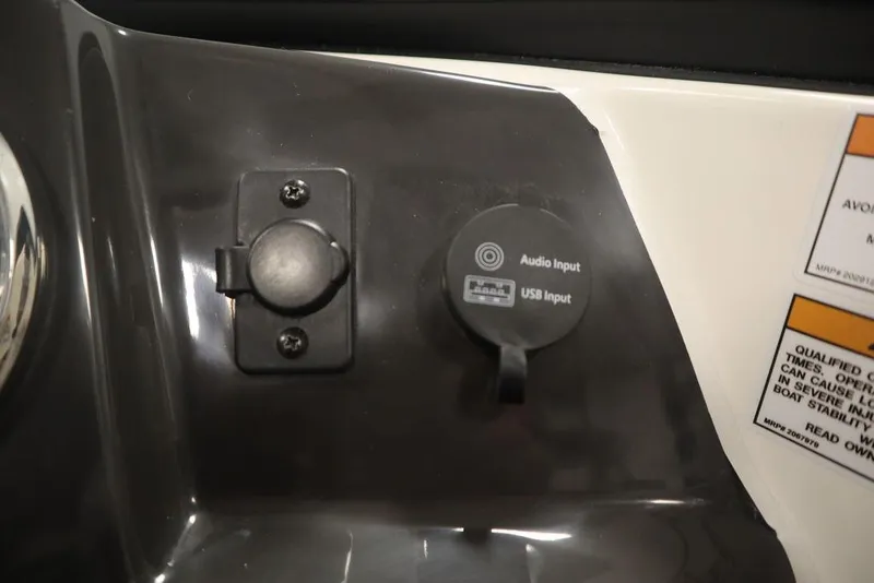Slide: The Image of 2024 Bayliner VR4 Bowrider audio and USB input panel. - 23