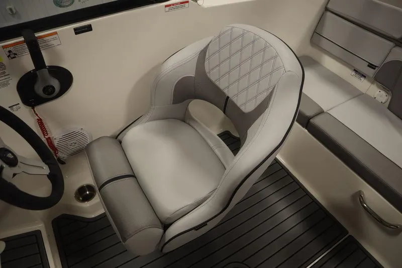Slide: The Image of 2024 Bayliner VR4 Bowrider captain's seat and cockpit area. - 24
