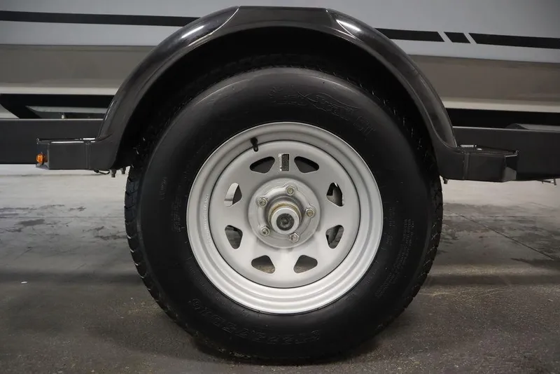 Slide: The Image of Close-up of a 2024 Bayliner VR4 Bowrider trailer wheel. - 25