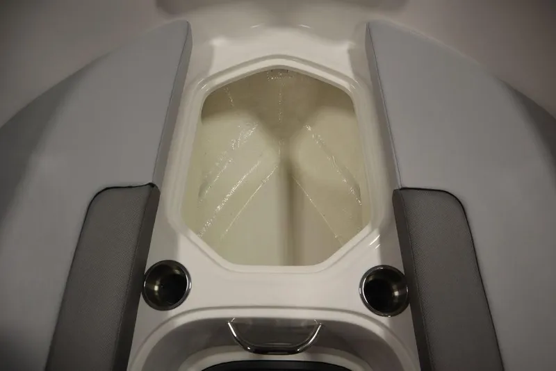 Slide: The Image of 2024 Bayliner VR4 Bowrider interior storage compartment with cup holders. - 27