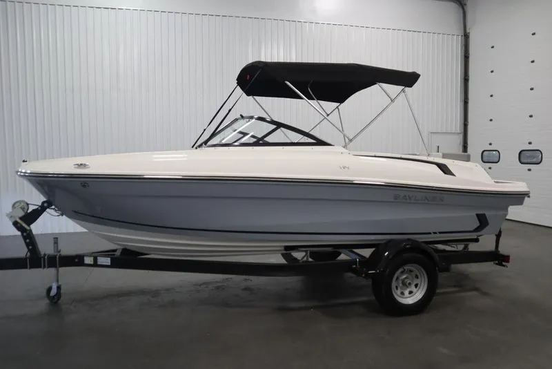 Slide: The Image of 2024 Bayliner VR4 Bowrider boat in a showroom, side view. - 28