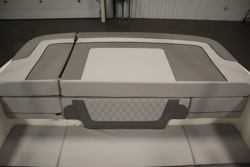 Slide: The Image of 2024 Bayliner VR4 Bowrider rear seating area with gray and white upholstery. - 39