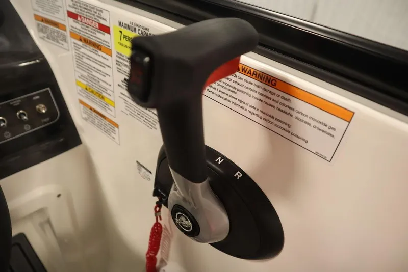Slide: The Image of 2024 Bayliner VR4 Bowrider throttle control and warning labels. - 41