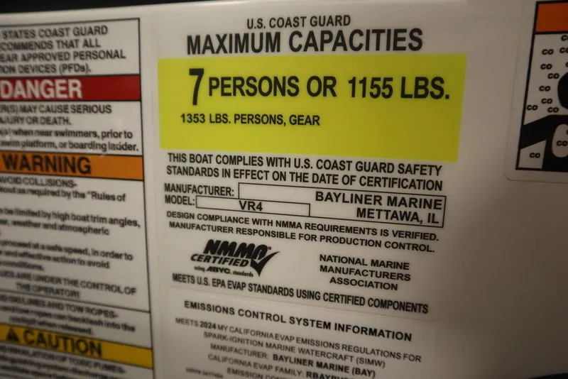 Slide: The Image of 2024 Bayliner VR4 Bowrider capacity label: 7 persons or 1155 lbs, 1353 lbs with gear. - 47