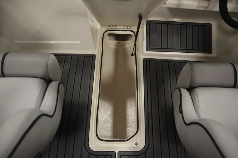 Slide: The Image of 2024 Bayliner VR4 Bowrider interior with storage compartment and seating. - 8