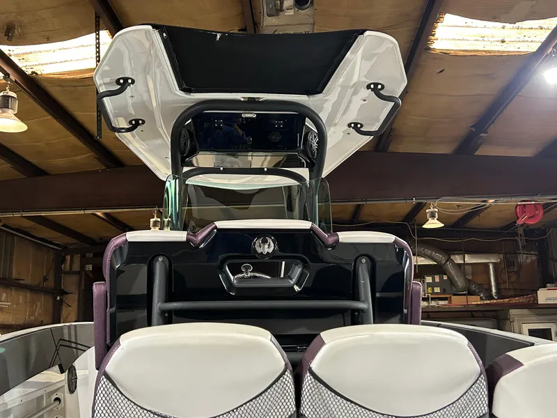 Slide: The Image of 2021 Scarab 255 Open ID boat in a warehouse, rear view. - 11