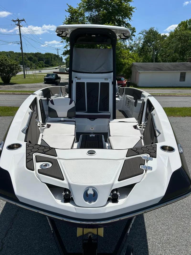 Slide: The Image of 2021 Scarab 255 Open ID boat, sleek design, spacious deck, outdoor setting. - 17