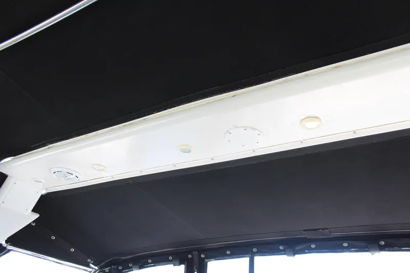 Slide: The Image of Interior ceiling of a 1996 Trojan 440 Express boat with lighting fixtures. - 14