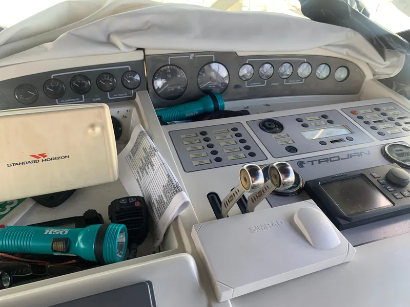 Slide: The Image of Control panel of a 1996 Trojan 440 Express boat with navigation equipment. - 20