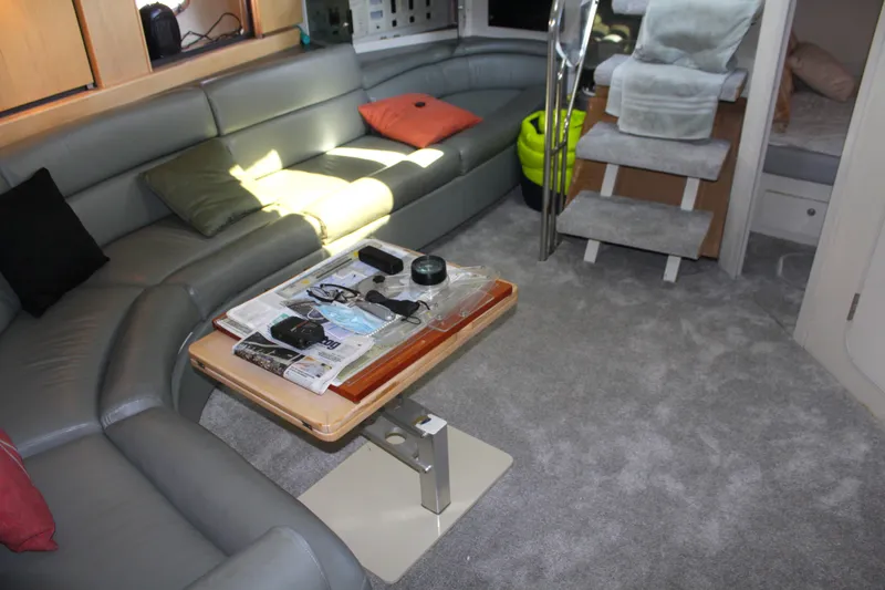 Slide: The Image of Luxurious interior of a 1996 Trojan 440 Express yacht with plush seating and modern decor. - 33