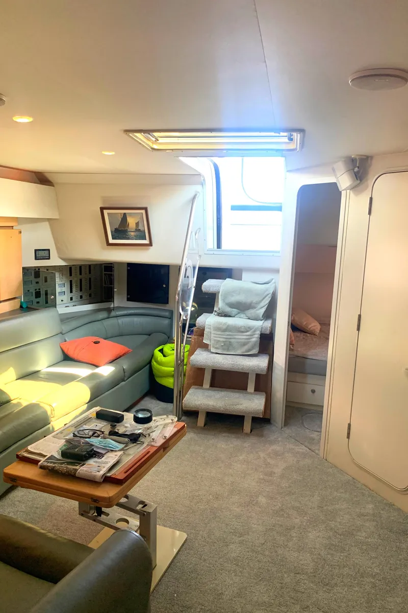 Slide: The Image of Interior of 1996 Trojan 440 Express yacht with cozy seating and modern decor. - 38