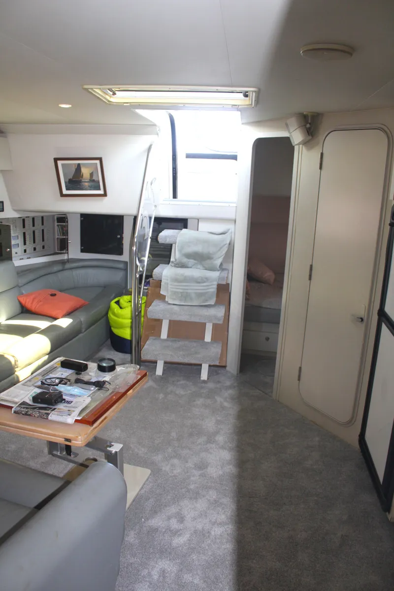 Slide: The Image of Interior of 1996 Trojan 440 Express yacht with modern seating and decor. - 39