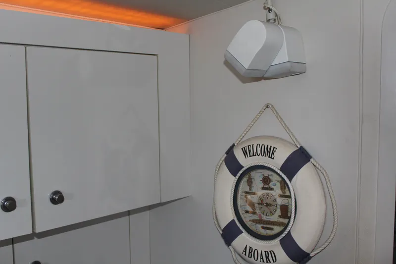 Slide: The Image of "Welcome Aboard" life preserver on 1996 Trojan 440 Express boat interior wall. - 41