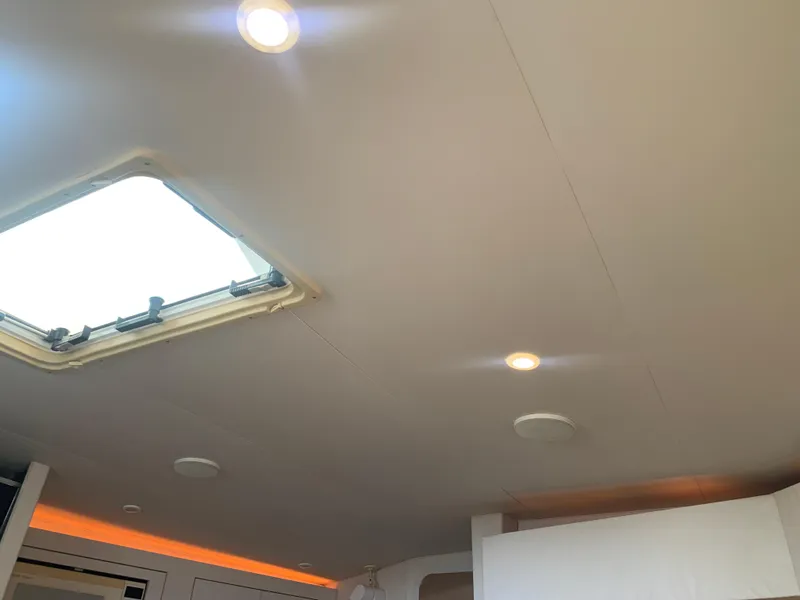 Slide: The Image of Ceiling interior of 1996 Trojan 440 Express boat with skylight and recessed lighting. - 42