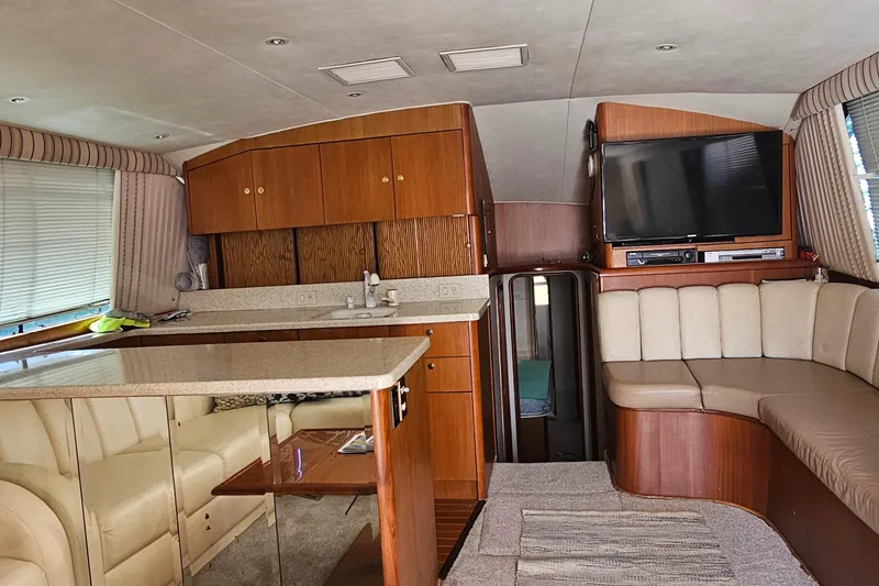 Slide: The Image of Engine room of 1999 Ocean Yachts 48 Super Sport, showcasing mechanical components. - 20