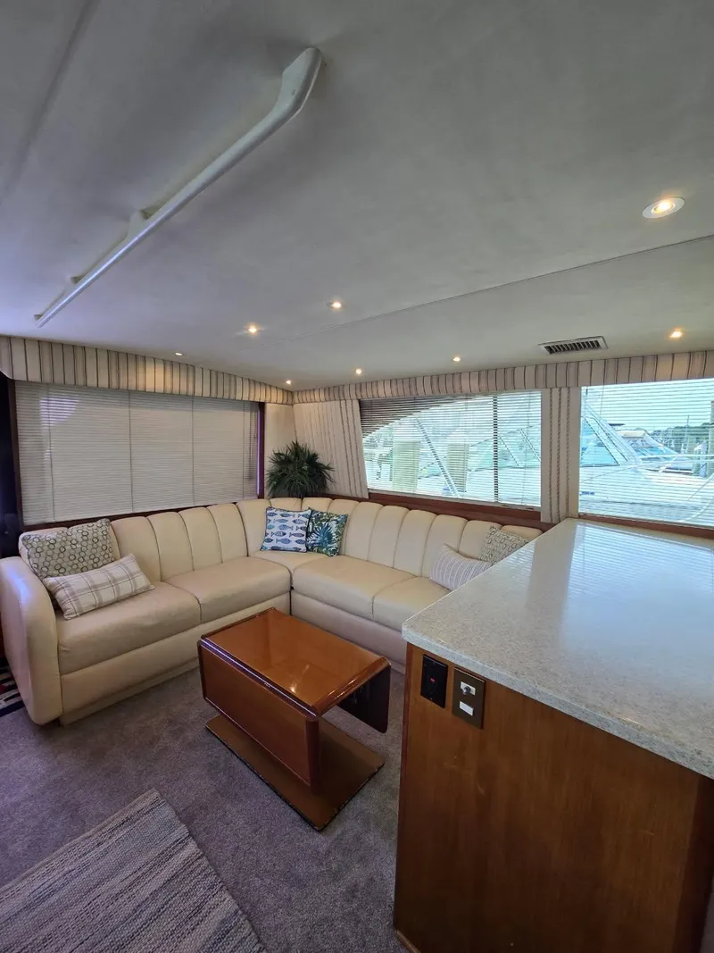 Slide: The Image of Cozy bedroom in 1999 Ocean Yachts 48 Super Sport with patterned bedding and wooden cabinets. - 27