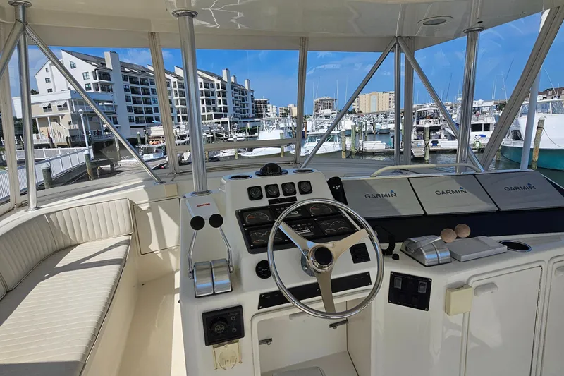 Slide: The Image of Helm of 1999 Ocean Yachts 48 Super Sport with Garmin navigation, docked at marina. - 6