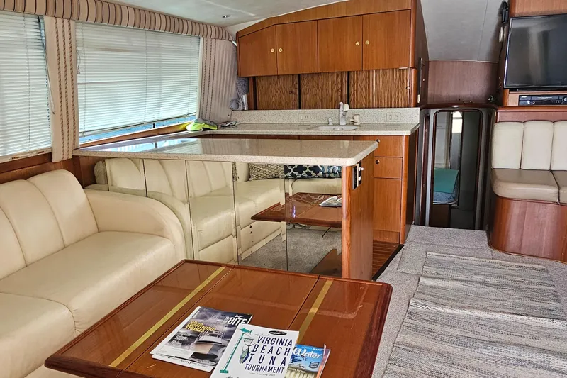 Slide: The Image of Interior of 1999 Ocean Yachts 48 Super Sport with cozy seating and modern amenities. - 18