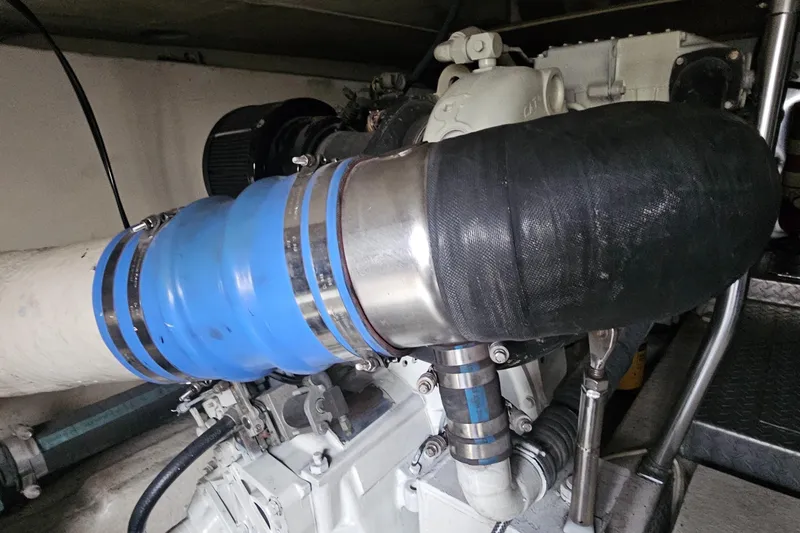 Slide: The Image of 1999 Ocean Yachts 48 Super Sport cockpit with seating, overlooking serene waters and blue sky. - 23