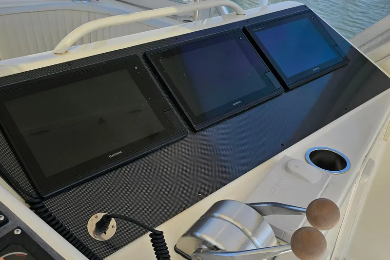 Slide: The Image of Control panel of a 1999 Ocean Yachts 48 Super Sport with Garmin displays. - 8