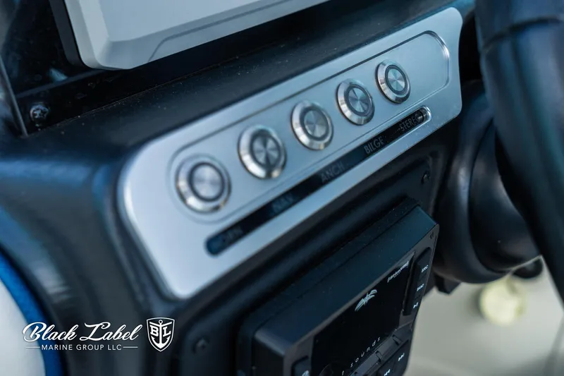 Slide: The Image of Dashboard controls of 2024 Crownline 260 XSS boat by Black Label Marine Group. - 15